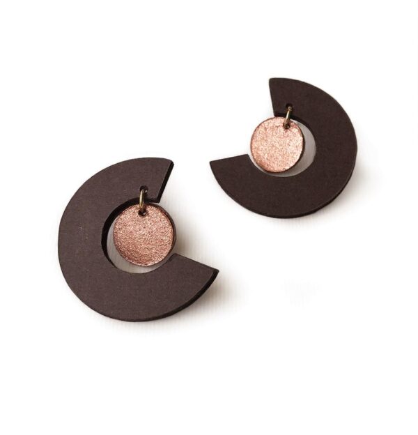 Brown-colored round stud earrings and small copper-colored pendant